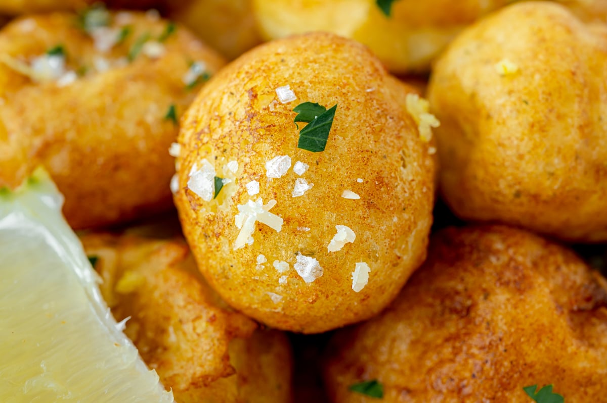 close up shot of one lemon ricotta fritter