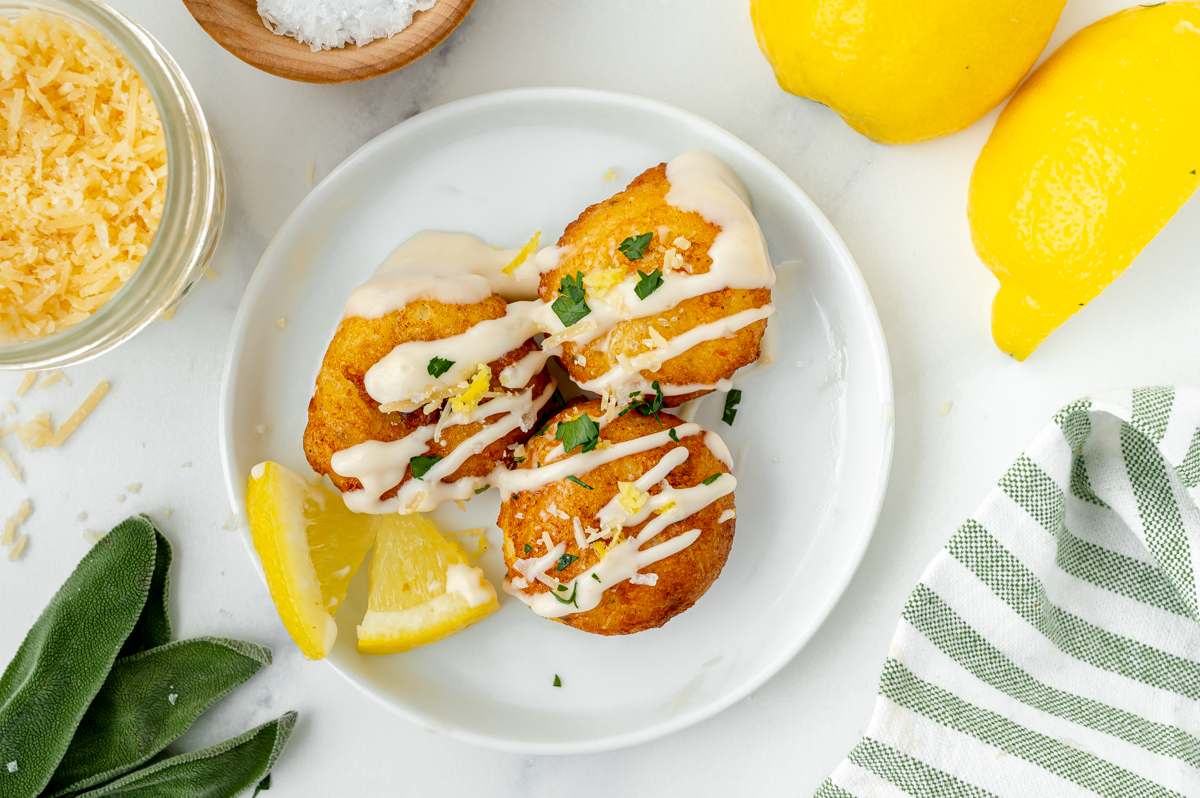 overhead shot of three savory fritters on a plate