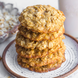 stack of quaker oats oatmeal cookies on a white speckled plate