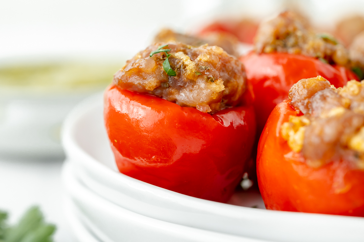 straight on close up shot of stuffed cherry peppers on plate