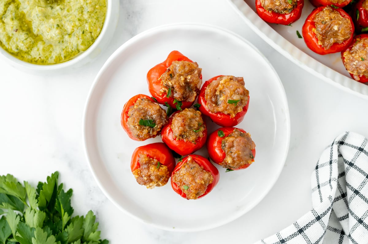 overhead shot of plate of sausage stuffed cherry peppers