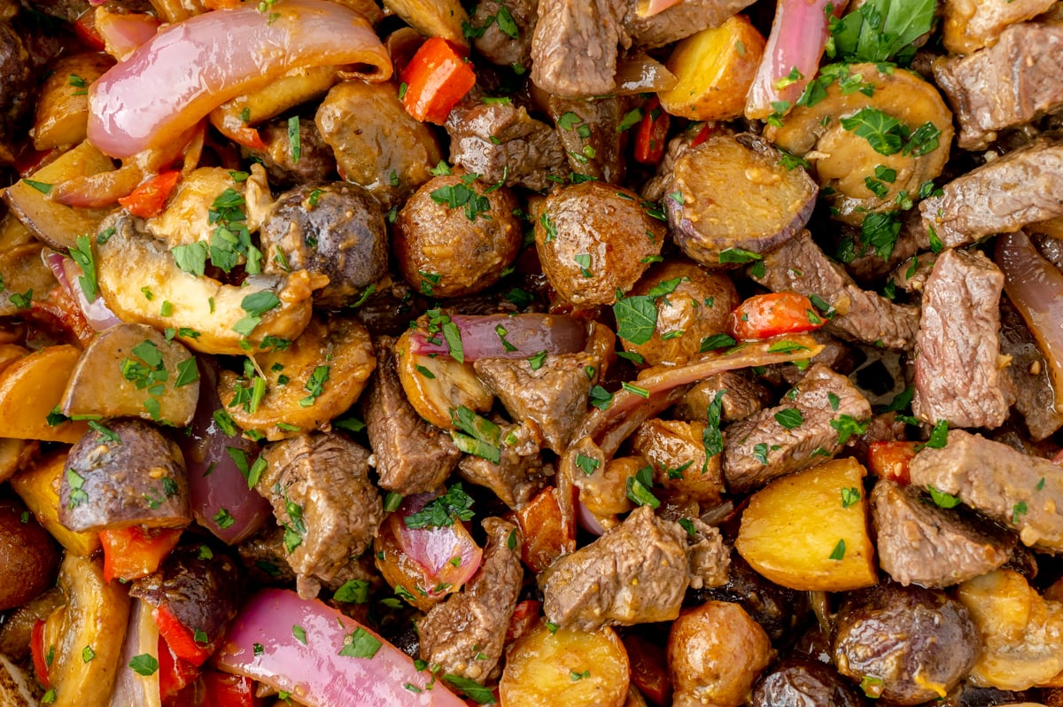 close up overhead shot of steak and potato skillet