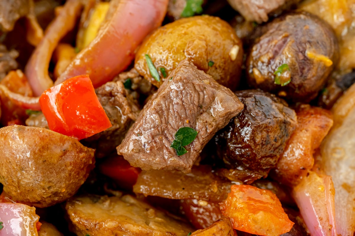 close up of bite of steak and potatoes