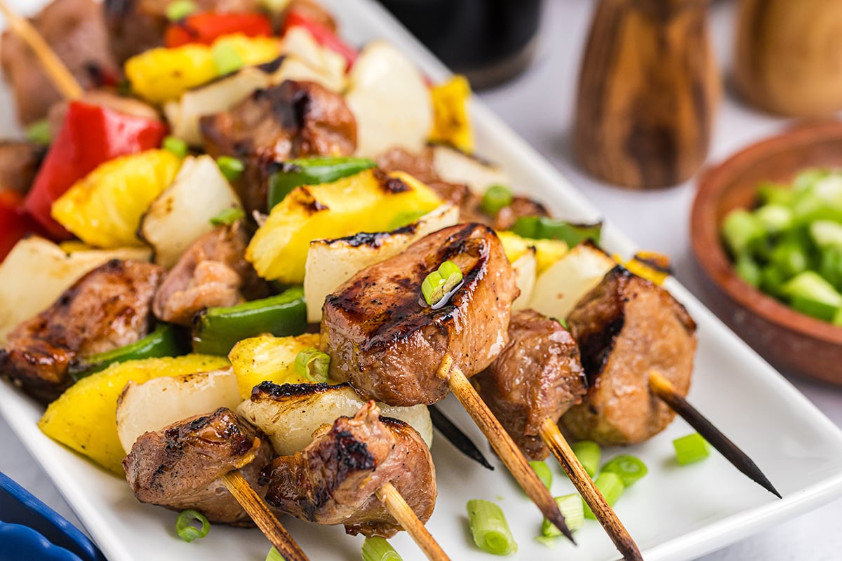 close up of teriyaki pork skewers