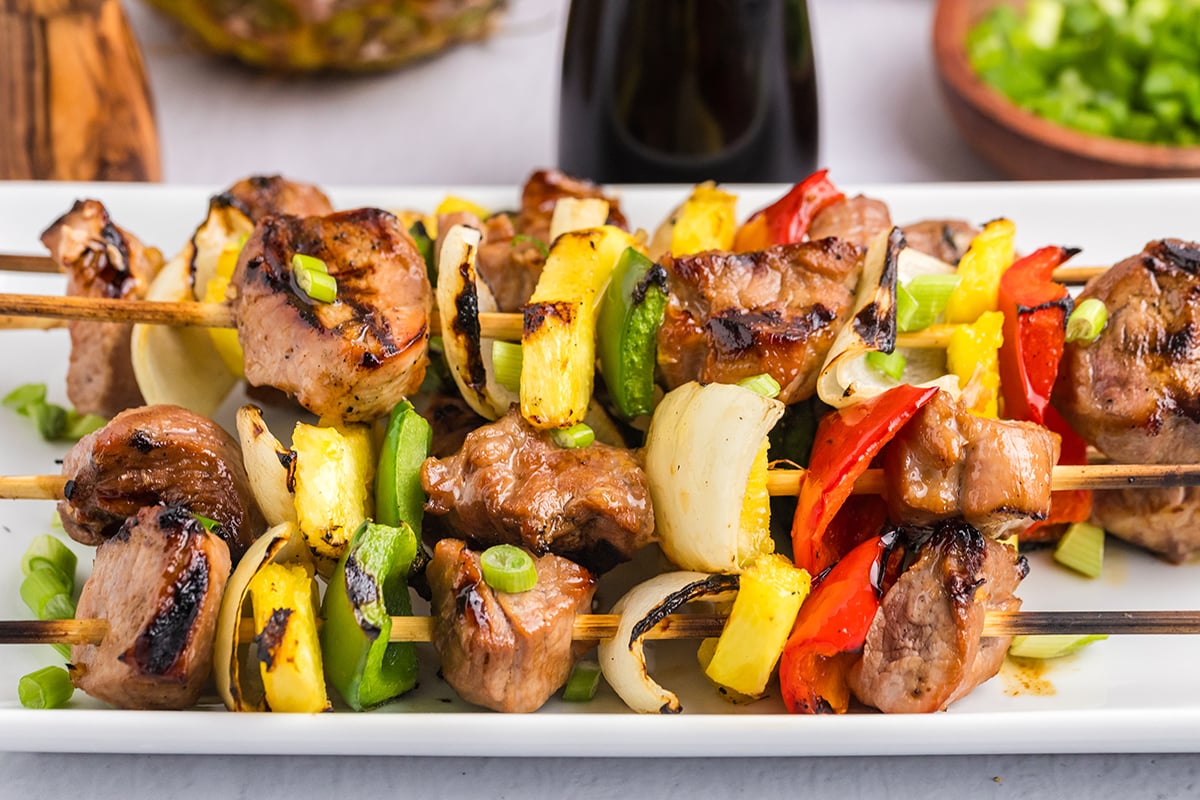 straight on shot of tray of teriyaki pork kabobs