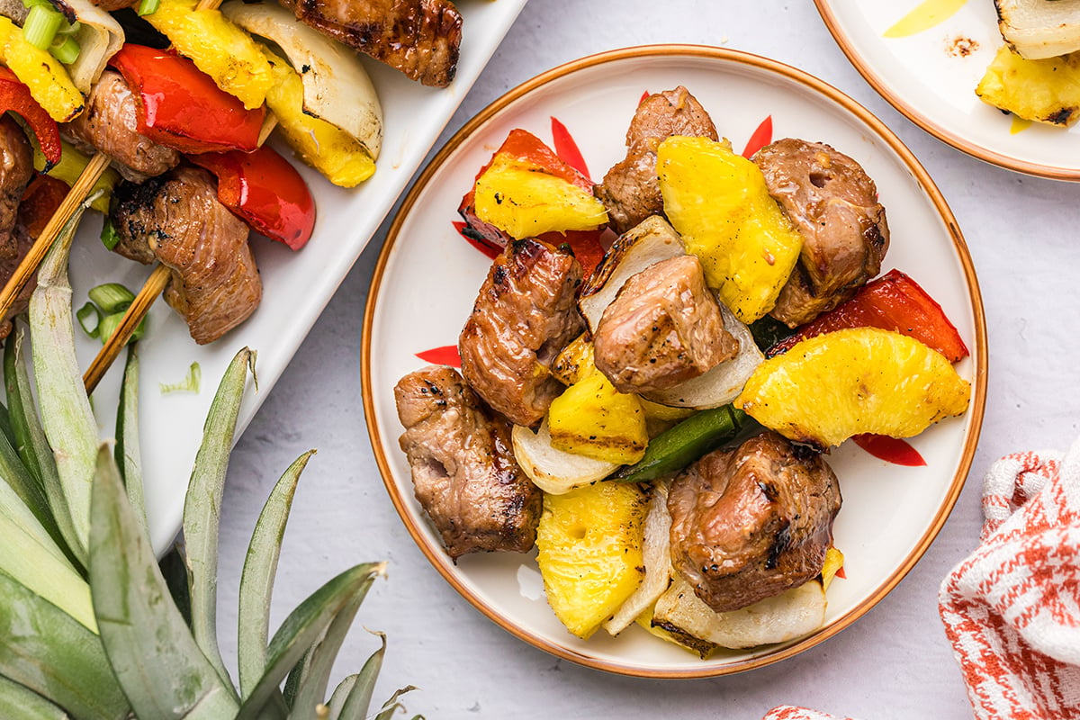 overhead shot of teriyaki pork kabob ingredients on plate