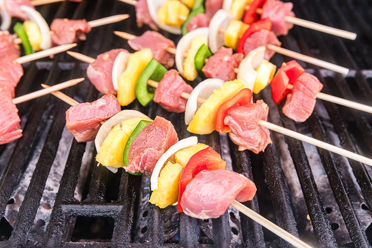 teriyaki pork kabobs cooking on grill