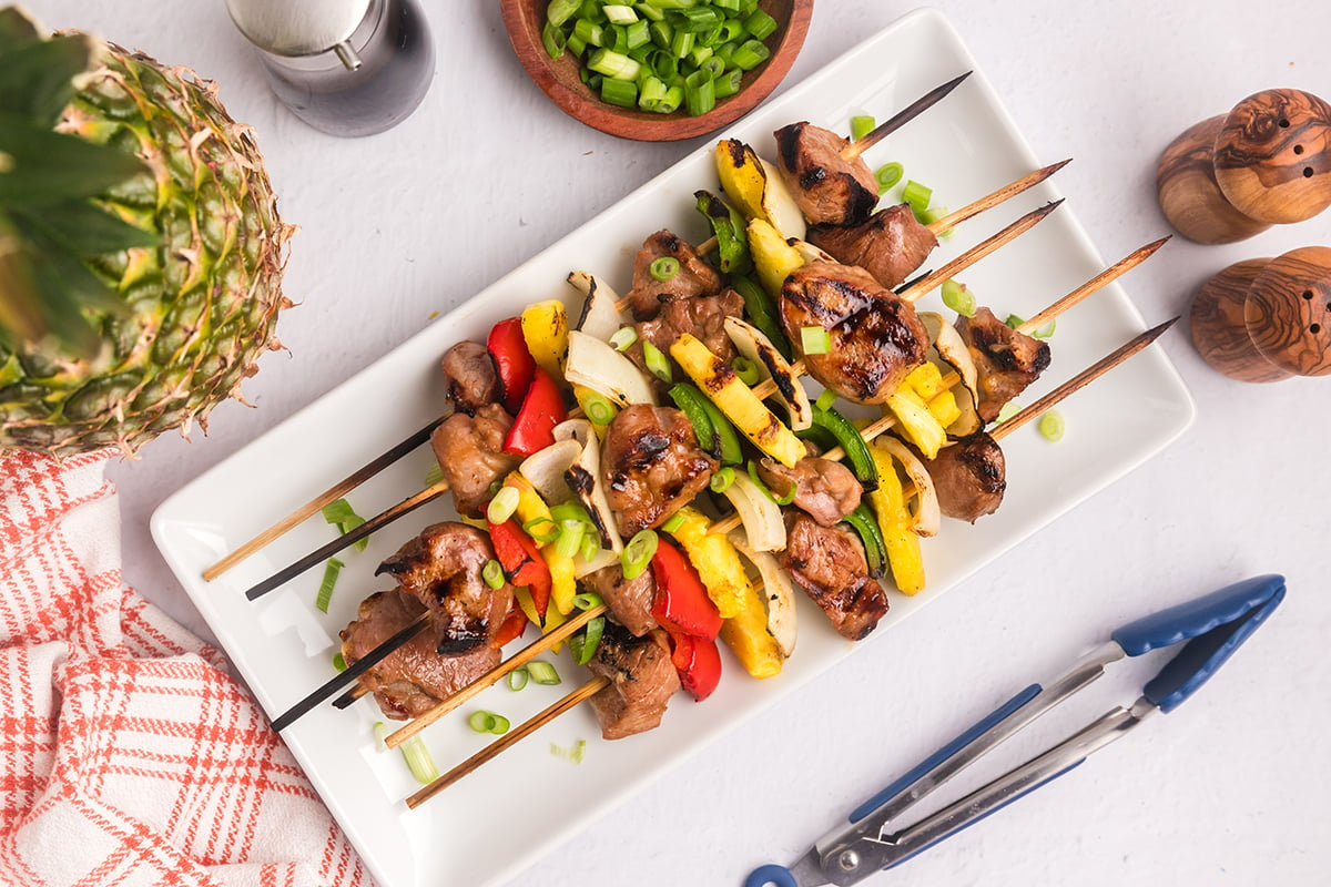 overhead shot of grilled pork kabobs on tray