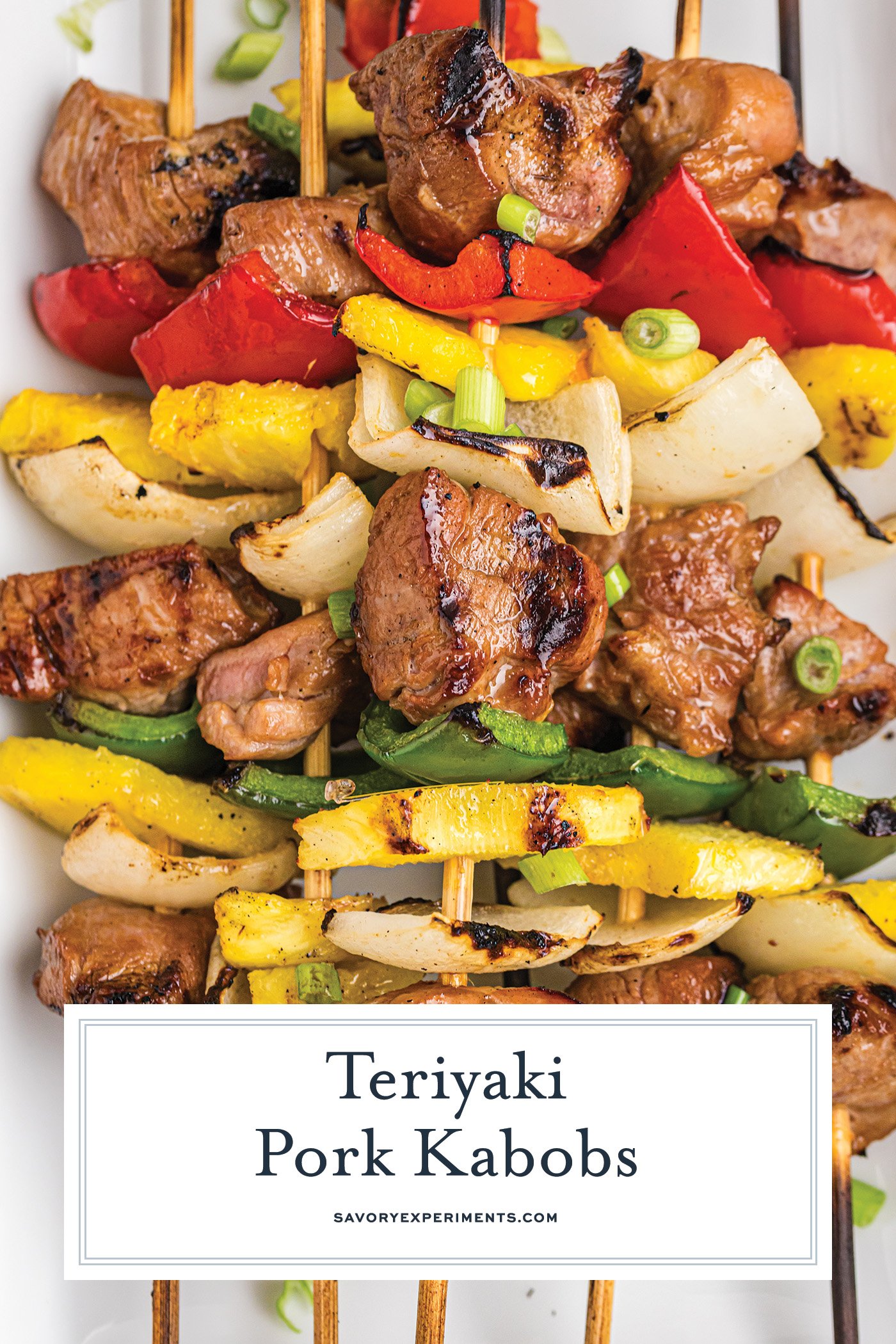 overhead shot of try of teriyaki pork kabobs with text overlay