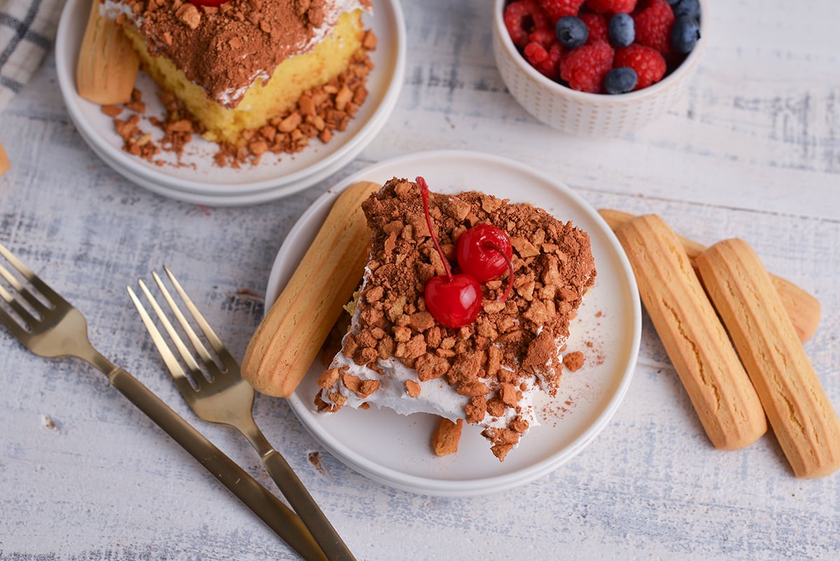 overhead shot of slice of tiramisu poke cake on plate