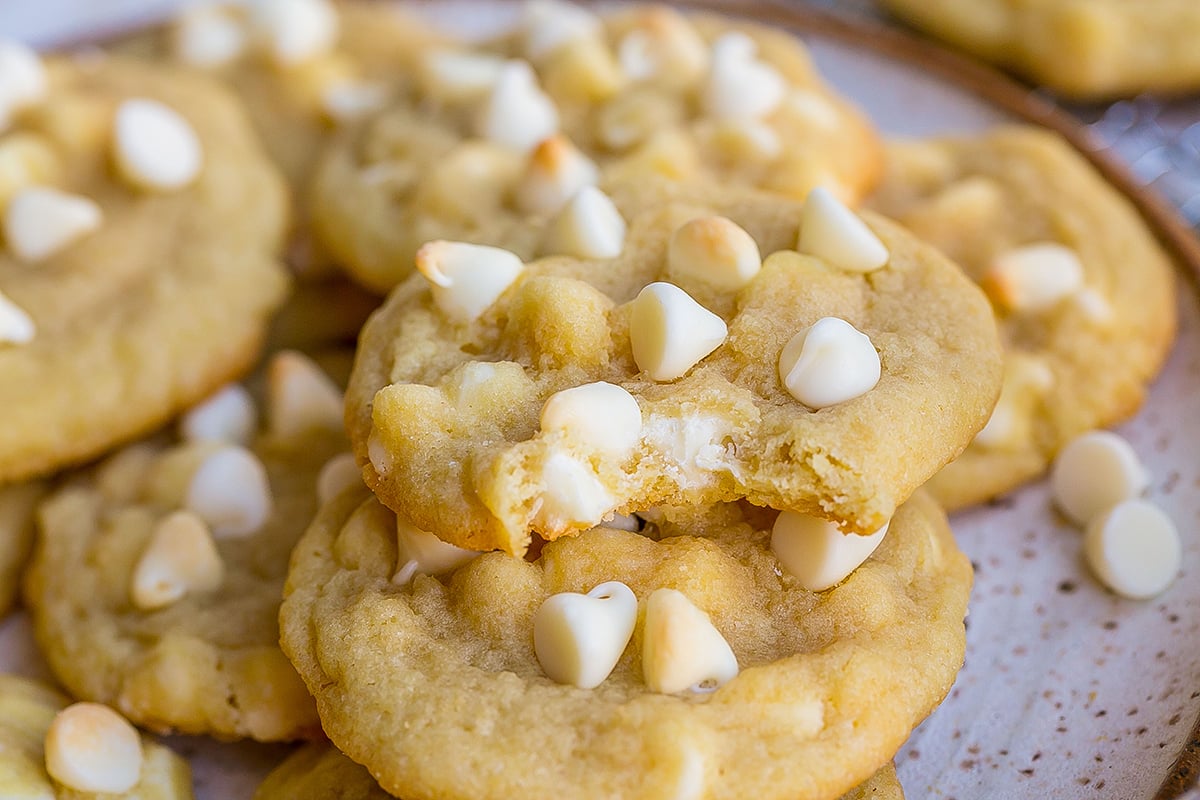 close up of bite taken out of white chocolate chip cookie
