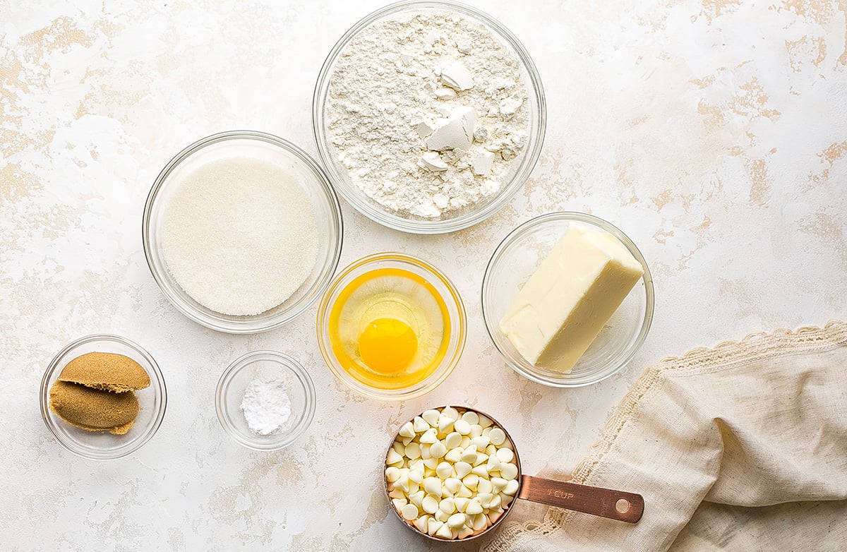 overhead shot of white chocolate chip cookies ingredients