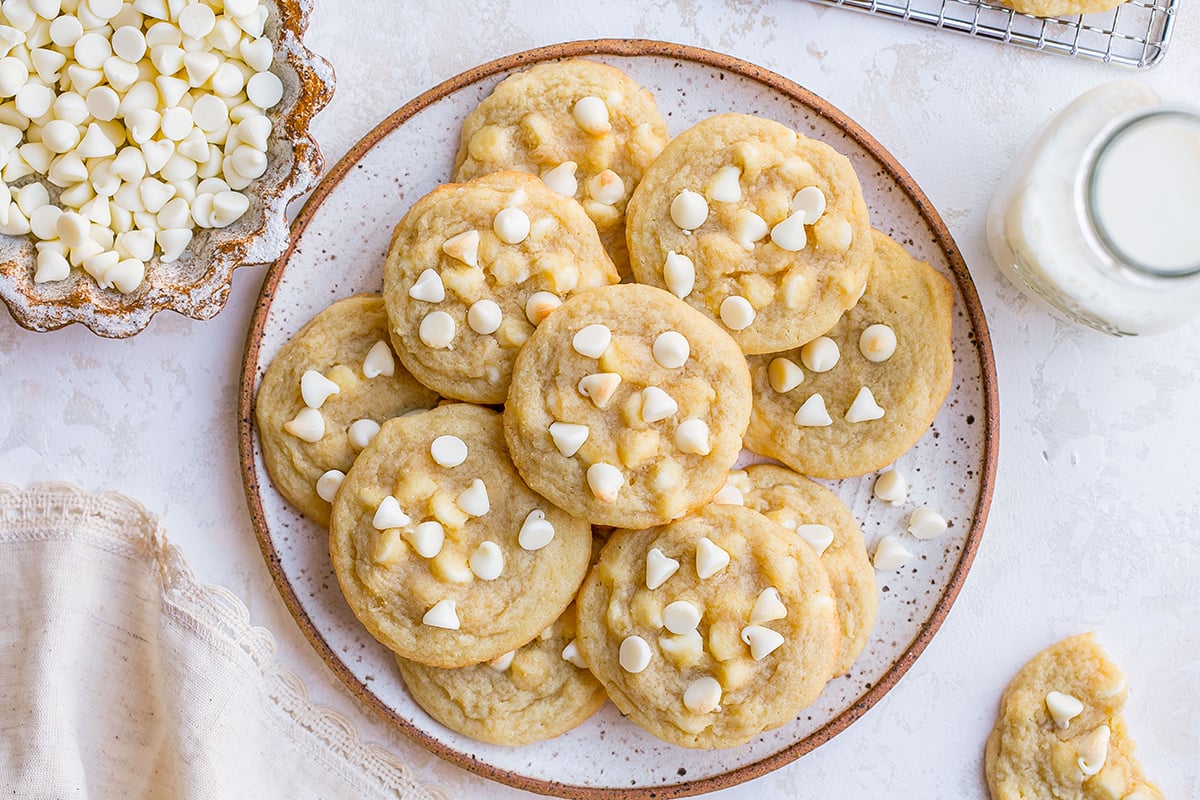 overhead shot of plate of white chocolate chip cookies