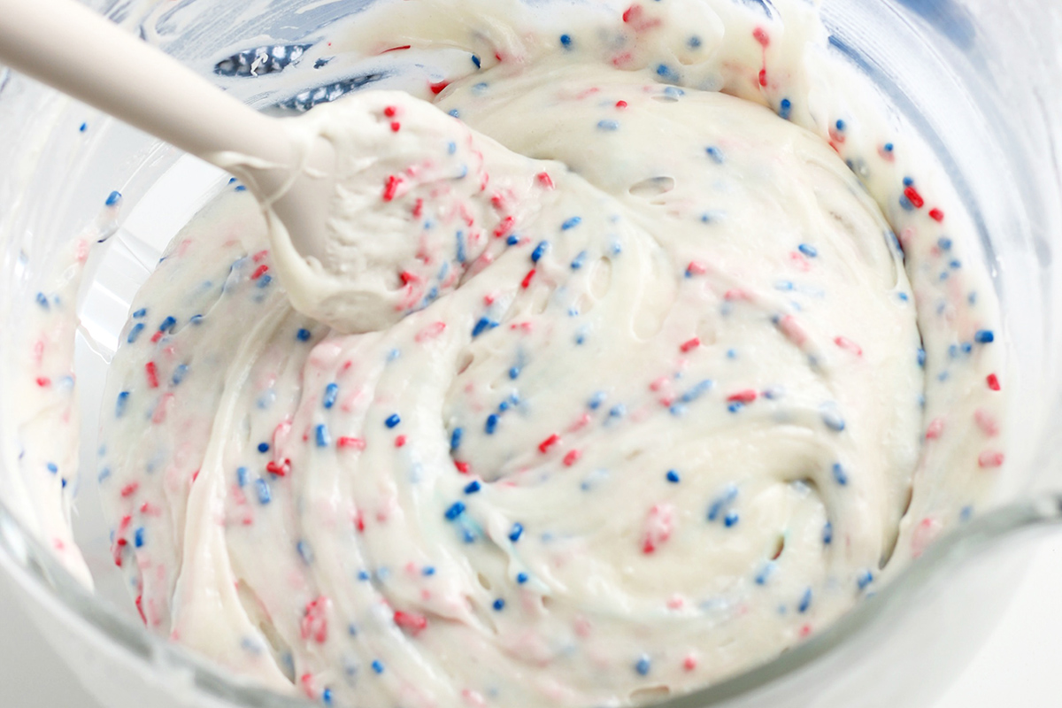 red and blue sprinkles in white batter