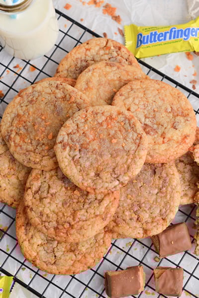 overhead shot of piled of butterfinger cookies on cooling rack