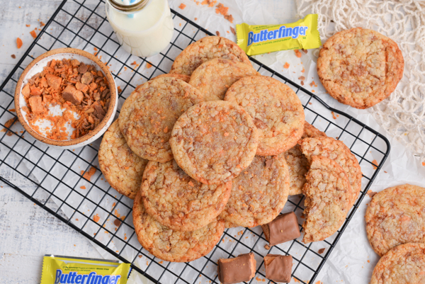 overhead shot of piled of butterfinger cookies on cooling rack