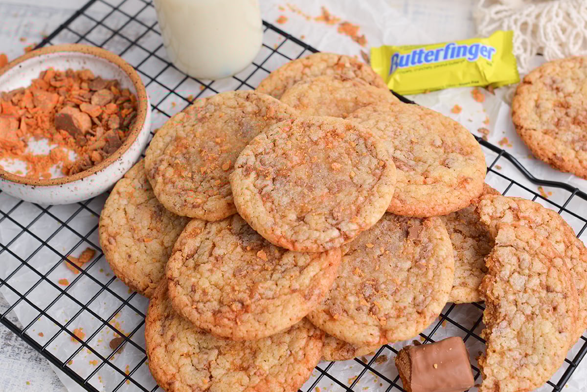 angled shot of pile of butterfinger cookies on cooling rack