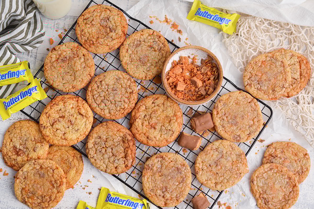 overhead shot of cookies with butterfingers on cooling rack