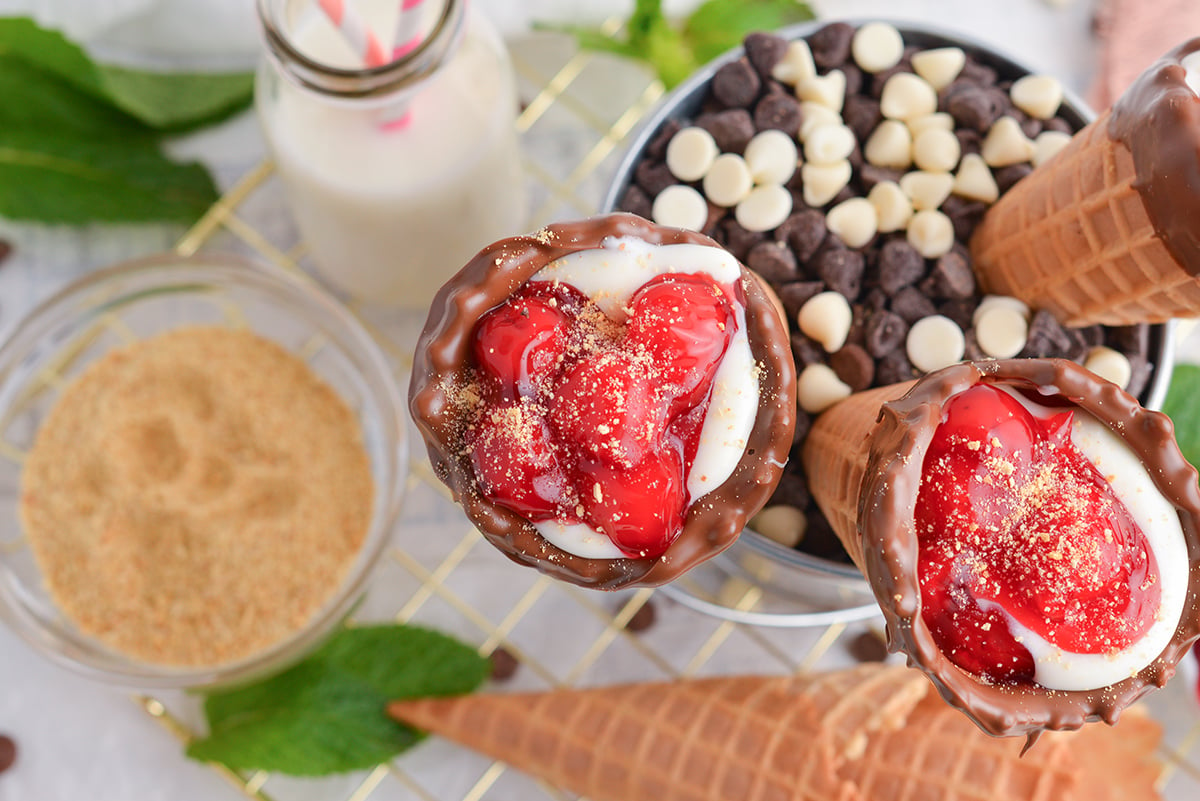 overhead shot of cherry cheesecake cones