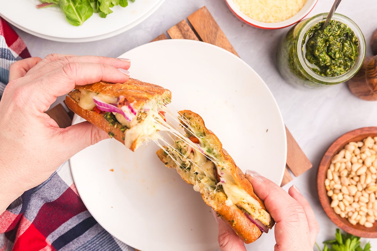 overhead shot of hands holding panini halves