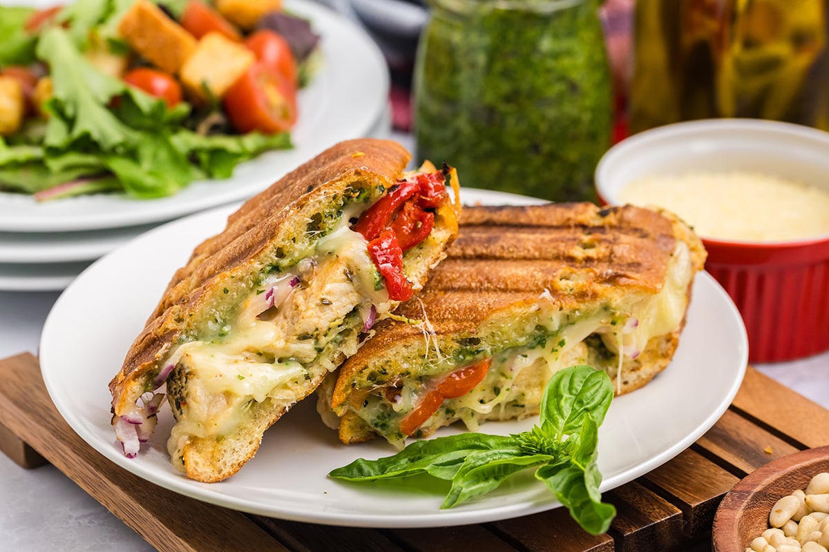 italian chicken panini halves on plate