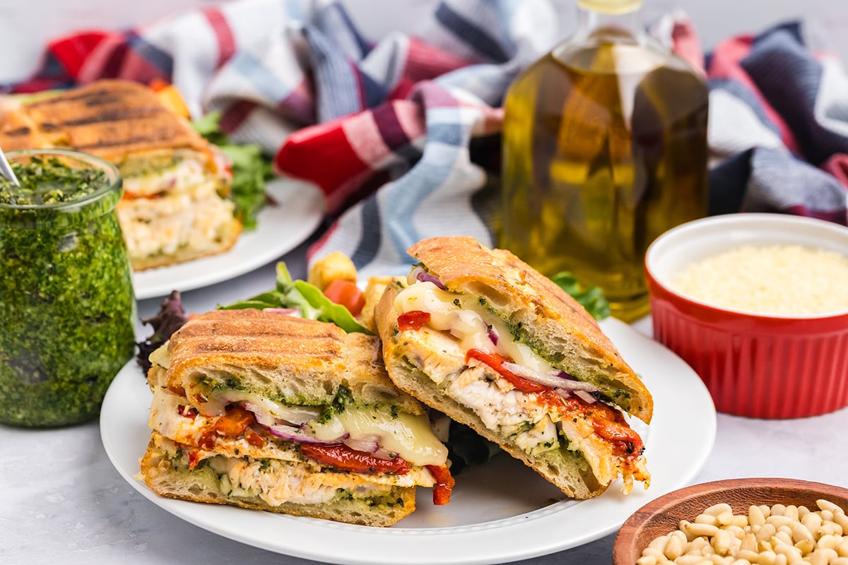 straight on shot of italian chicken panini halves on plate