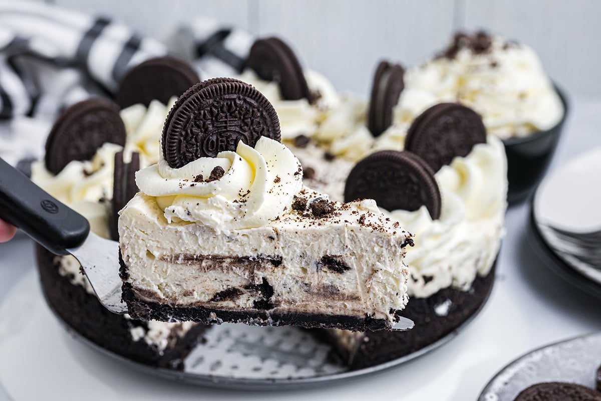 slice of no bake oreo cheesecake on spatula