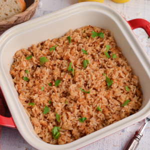 angled shot of butter rice recipe in baking dish