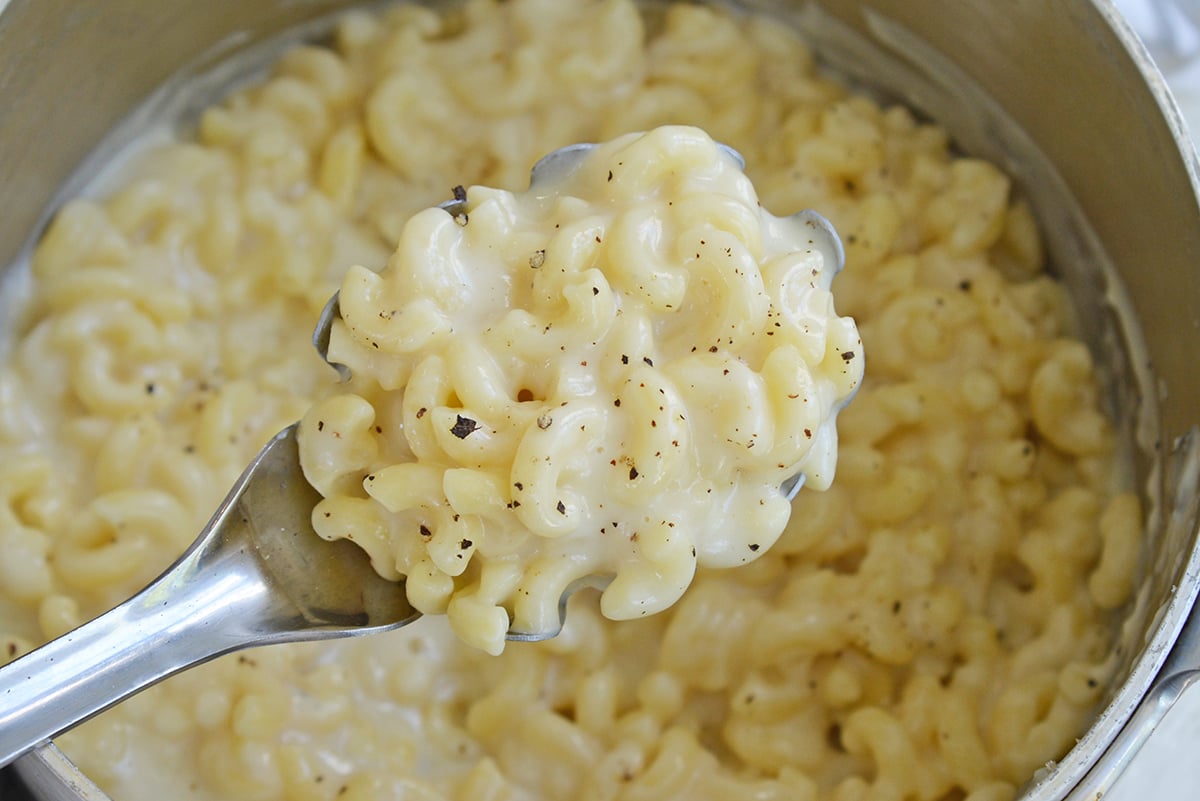 overhead shot of serving spoon of truffle mac and cheese recipe