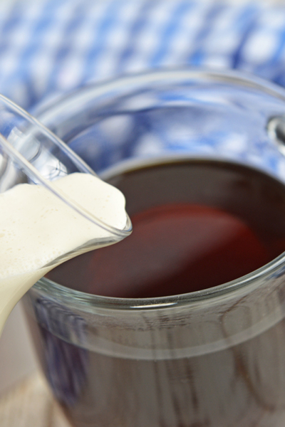 Homemade creamer pouring into coffee