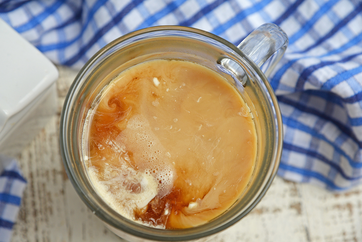 coffee creamer mixing into coffee