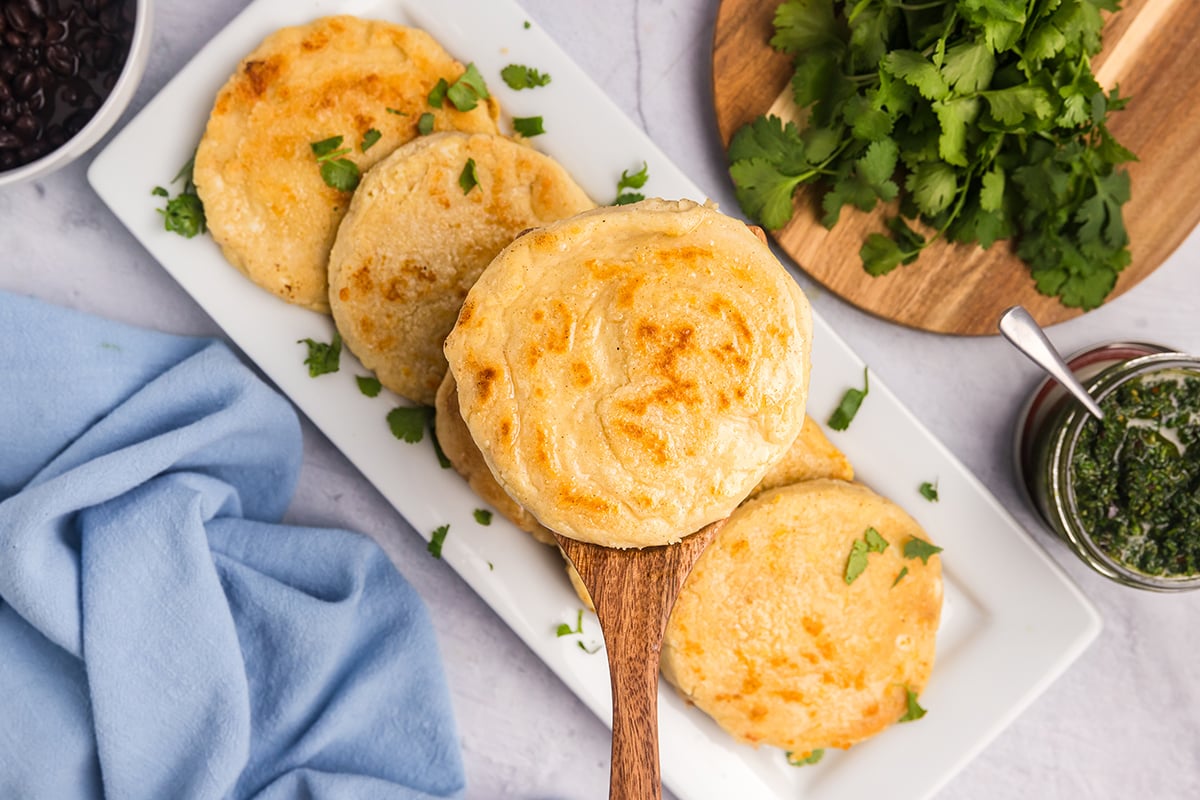 overhead shot of recipe for arepas on serving spoon