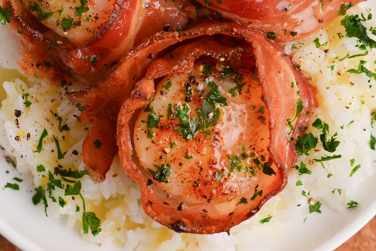 close up overhead shot of bacon wrapped scallop