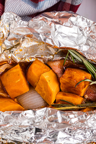 close up shot of chicken foil packet opening