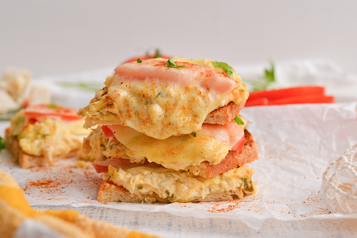 straight on shot of stack of crab melt sandwiches