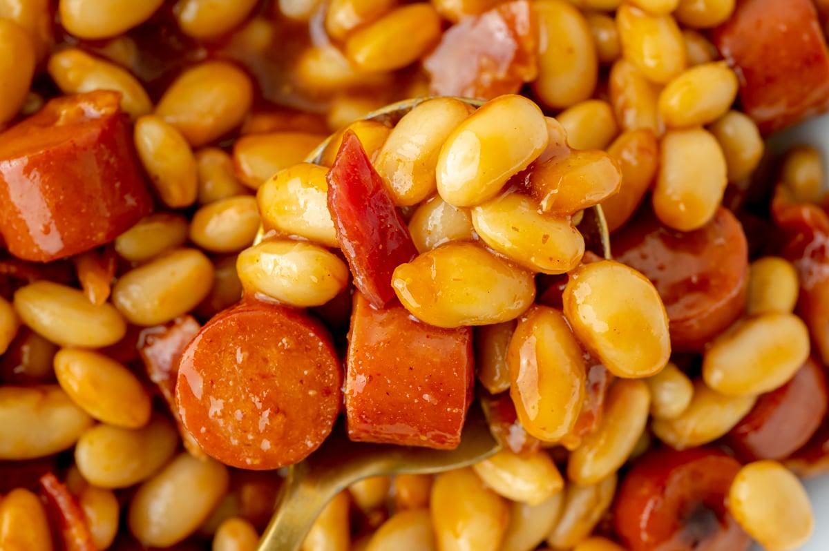 overhead shot of franks and beans on spoon