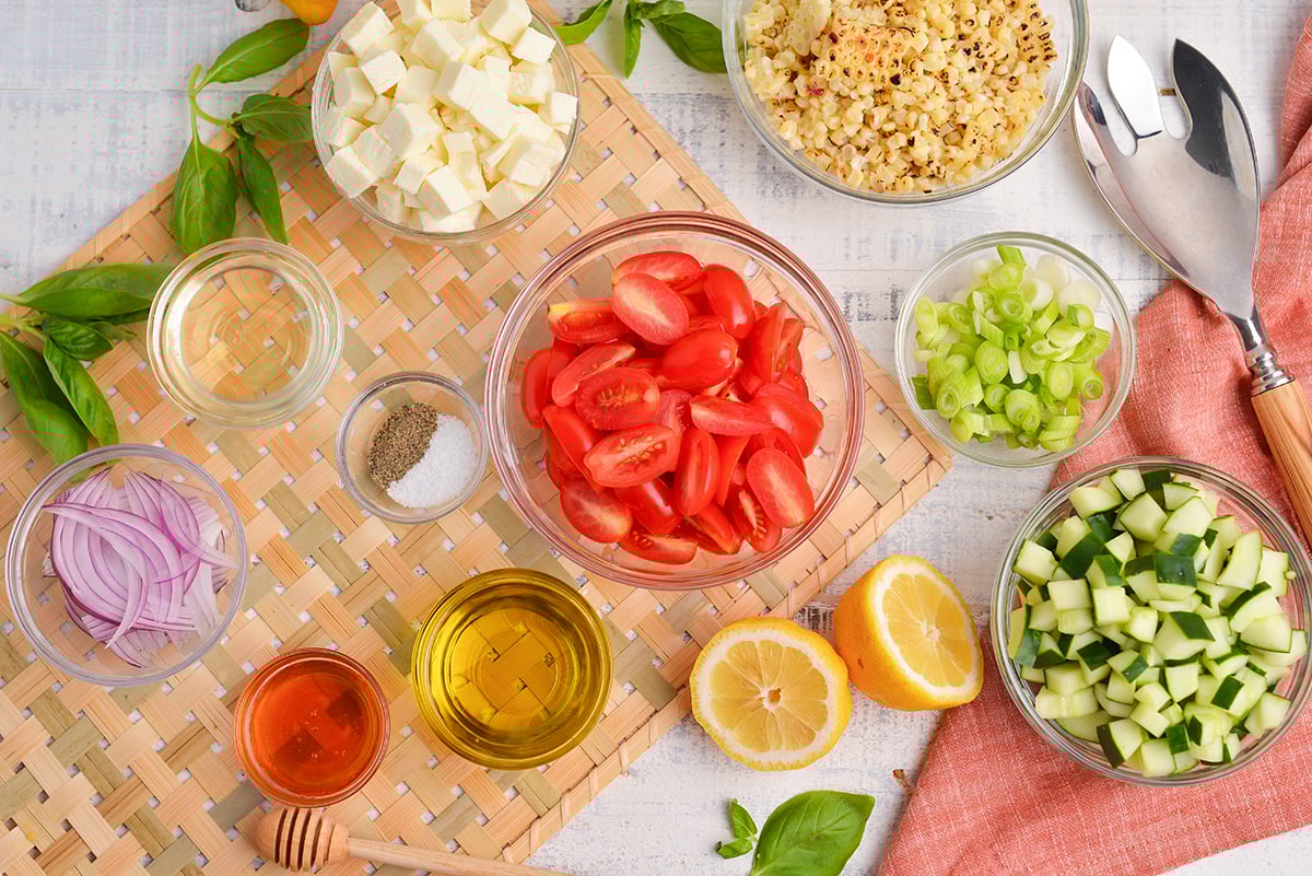 overhead shot of corn and tomato salad ingredients