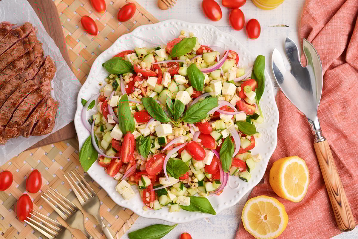 overhead shot of corn and tomato salad on plate