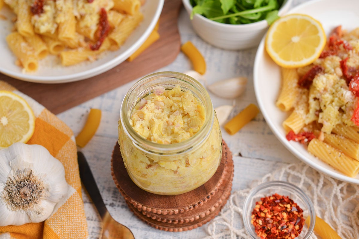 angled shot of jar of lemon pesto