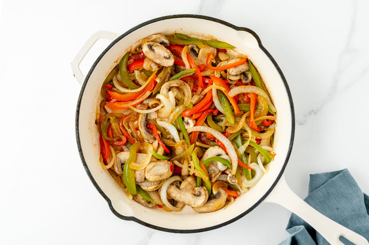 overhead shot of veggies cooking in pan