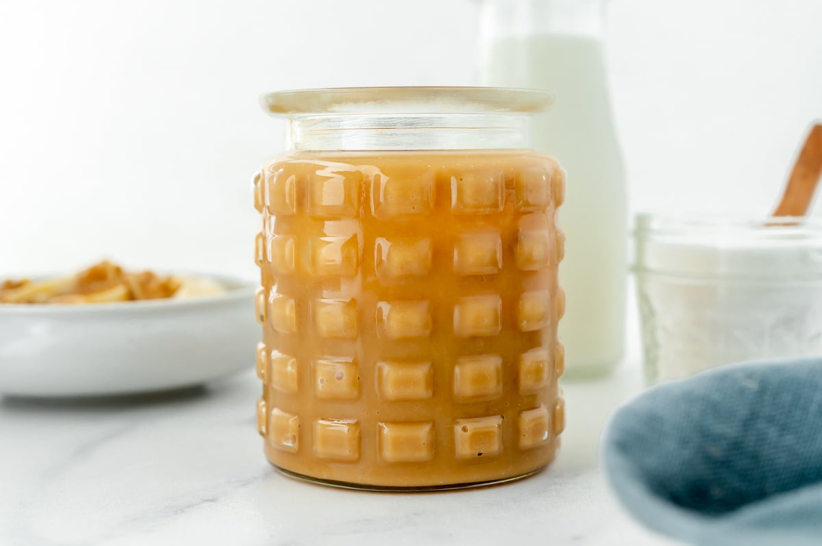straight on shot of jar of caramel