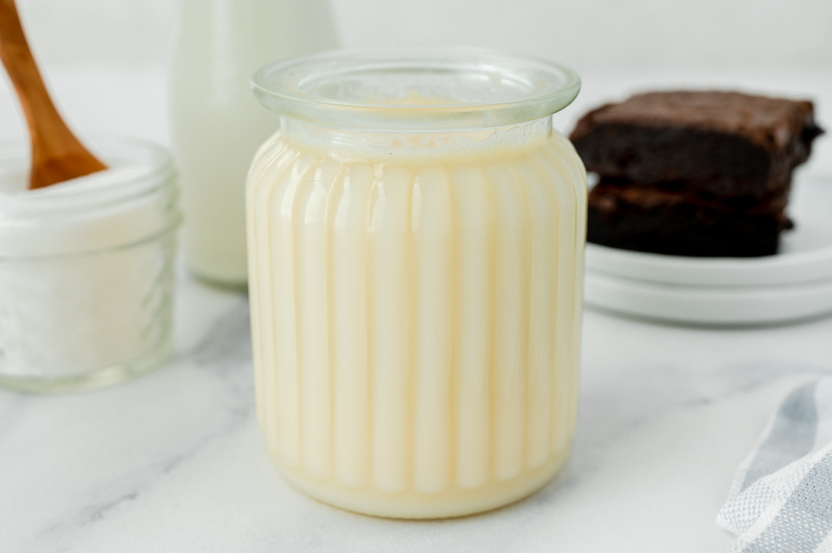 angled shot of jar of sweetened condensed milk