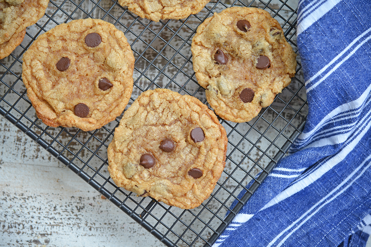 flourless peanut butter cookies with chocolate chips on a cooling rack
