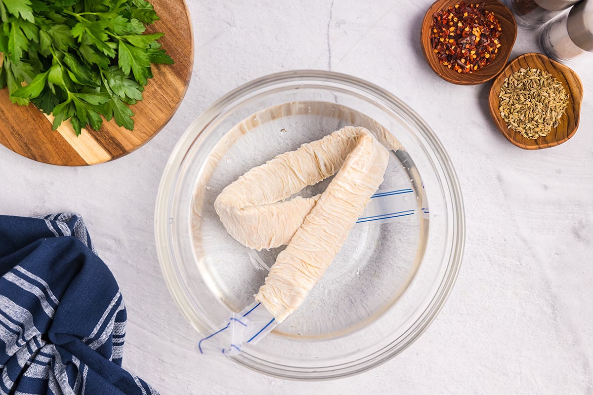 sausage casings in bowl of water