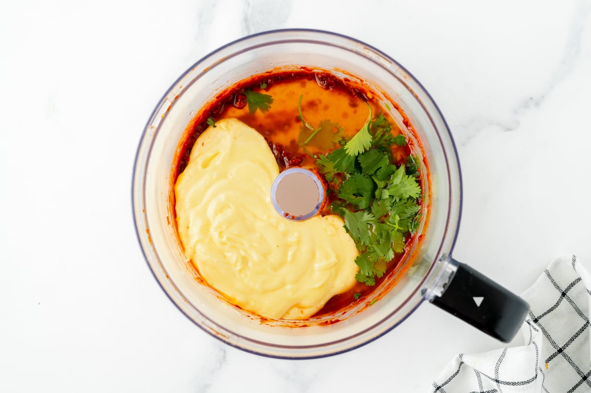 overhead shot of chipotle mayo ingredients in food processor