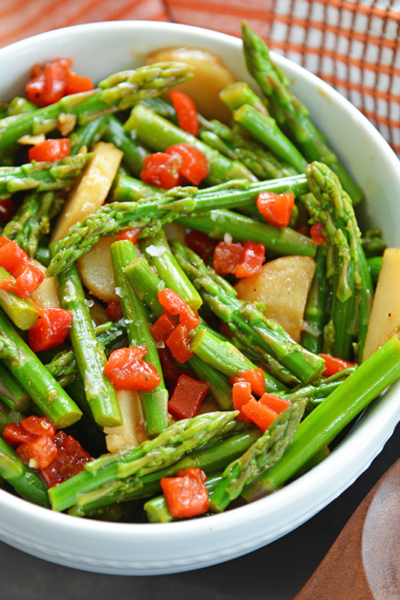 angled shot of bowl of pickled asparagus salad