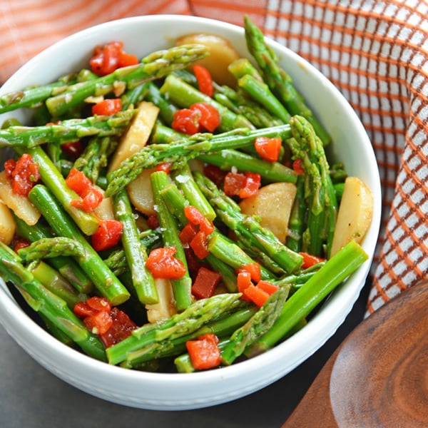 angled shot of bowl of pickled asparagus salad