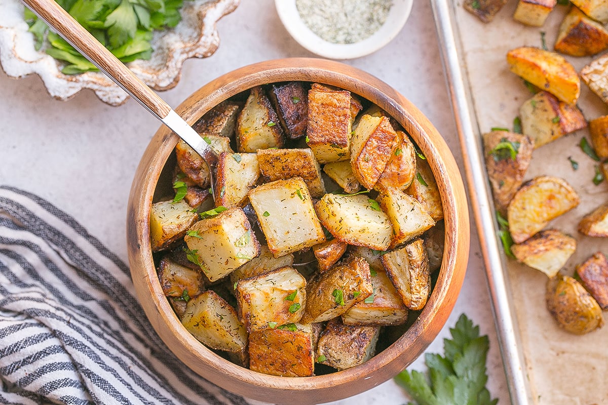 overhead shot of spoon in bowl of ranch potatoes
