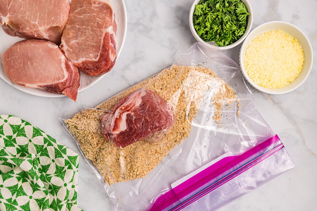 raw pork chop in bag of seasoning
