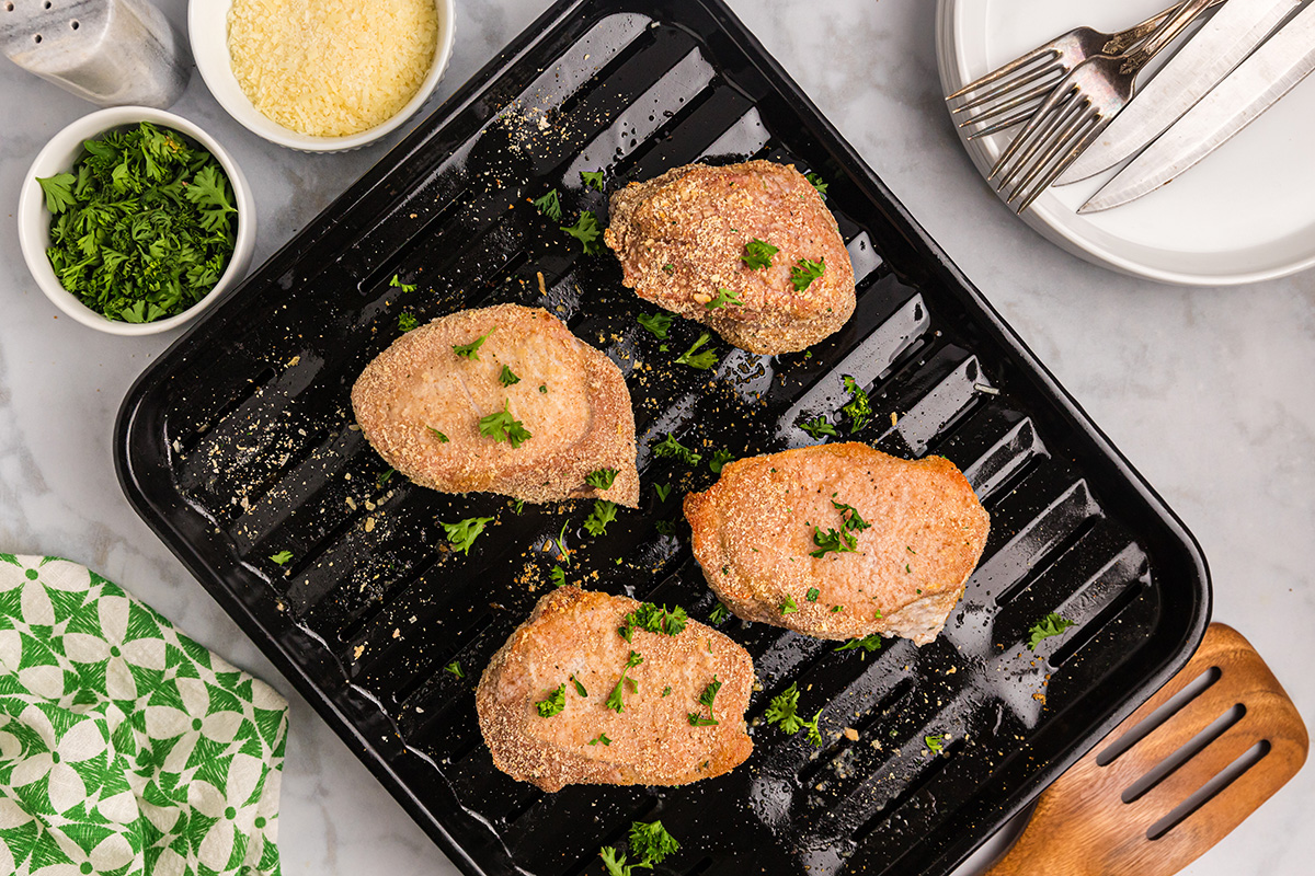 overhead shot of crispy pork chops on broiler pan